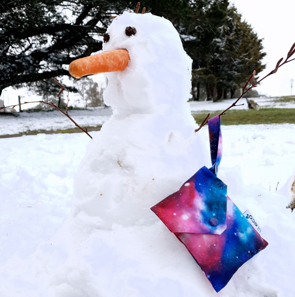 galaxy water resistant bag hanging on snowman
