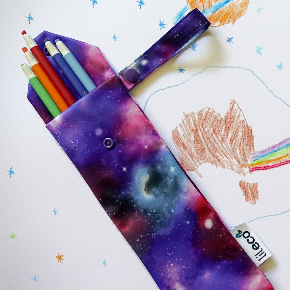 Tall galaxy water resistant bag with crayons on sketch