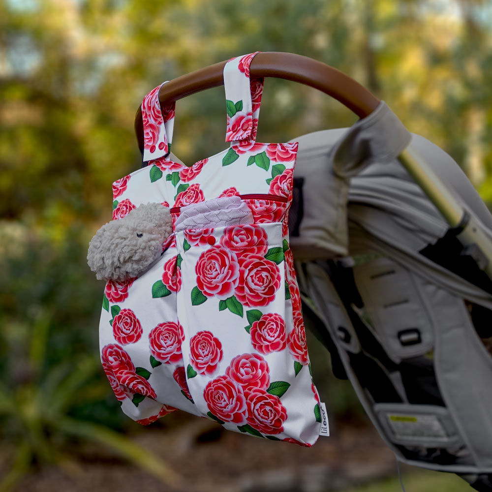 Camellia flower water resistant bag hanging on pram outside