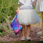 Load image into Gallery viewer, galaxy water resistant bag being held by girl in tutu dress
